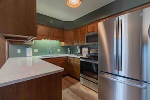 Quartz countertops brighten up the space with ease!