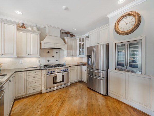 Enjoy cooking in this well-equipped kitchen with a gas stove, oven, and refrigerator.