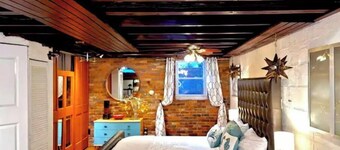 Live in this iconic East Side lower level apartment