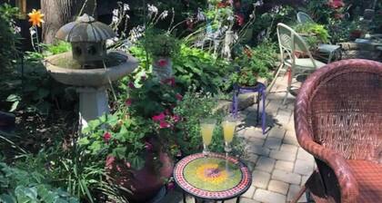 Live in this iconic East Side lower level apartment