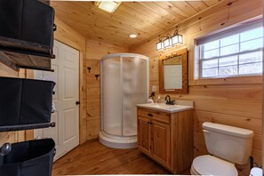 Shower, hair dryer, towels, toilet paper