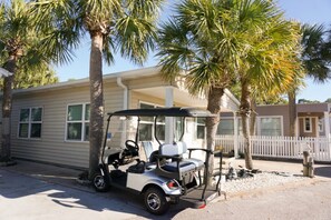 Enjoy a peaceful retreat with a front porch and garden area, perfect for relaxation.