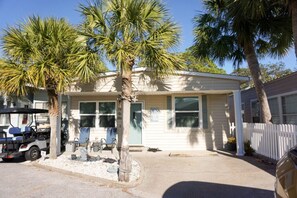 Enjoy outdoor dining or relaxation on the front porch of this charming home.