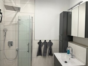 Shower, hair dryer, towels, soap