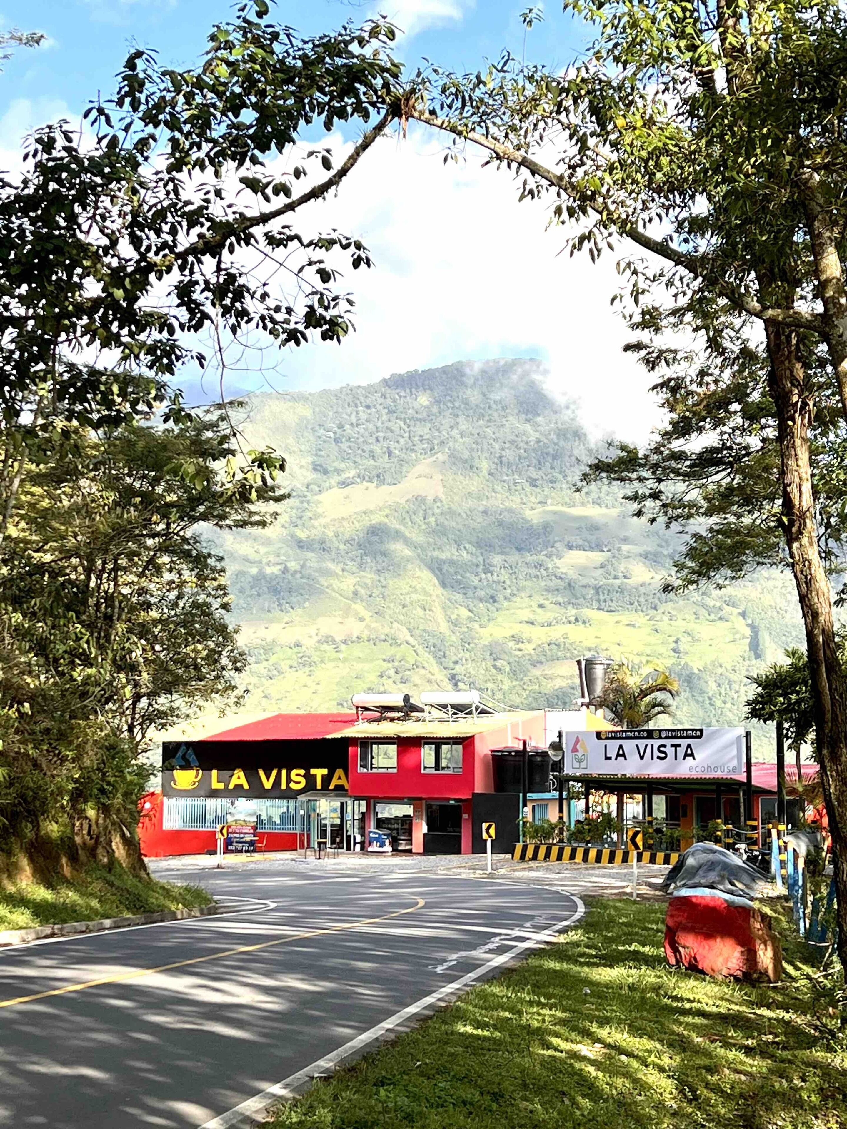 A red and white building named "La Vista" with a sign indicating it is an "ecohouse."
