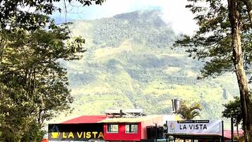 A red and white building named "La Vista" with a sign indicating it is an "ecohouse."