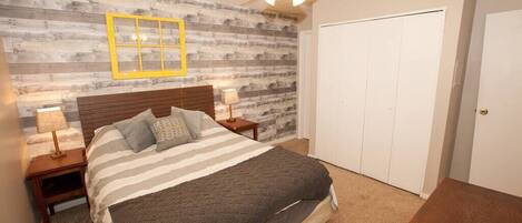 1 bedroom, desk, iron/ironing board, travel crib