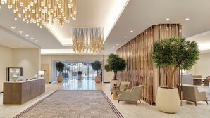 A modern lobby with a reception desk, seating area, and decorative lighting. - Address Jabal Omar Makkah (Makkah)