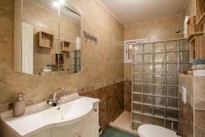 Shower, hair dryer, towels, soap