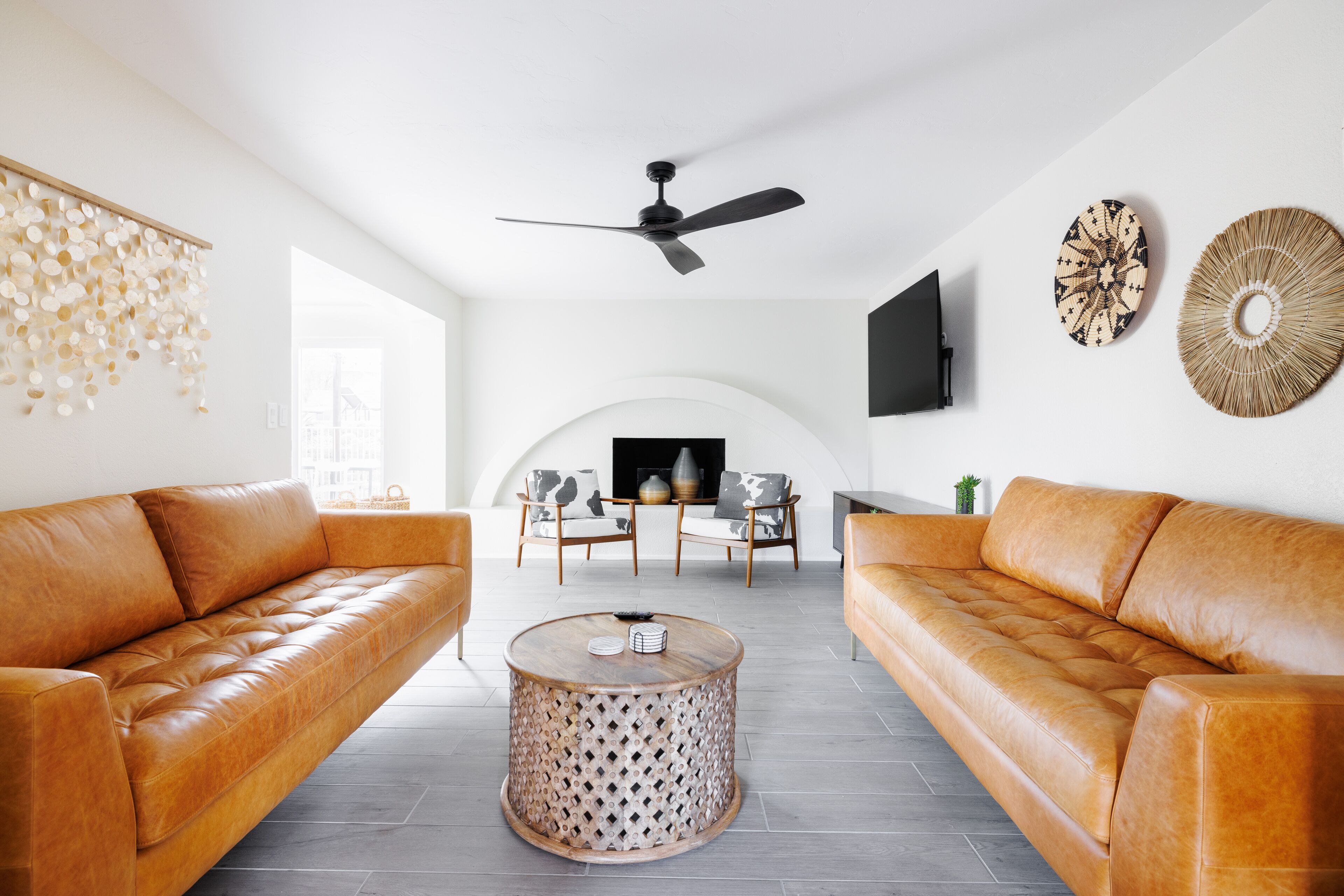 Smart TV, fireplace, books, computer monitors