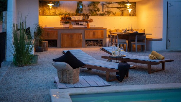 A cozy outdoor seating area with lounge chairs and a pool. - Villa Kucha 26b with Pool & Seaview (Vrbnik (Krk))