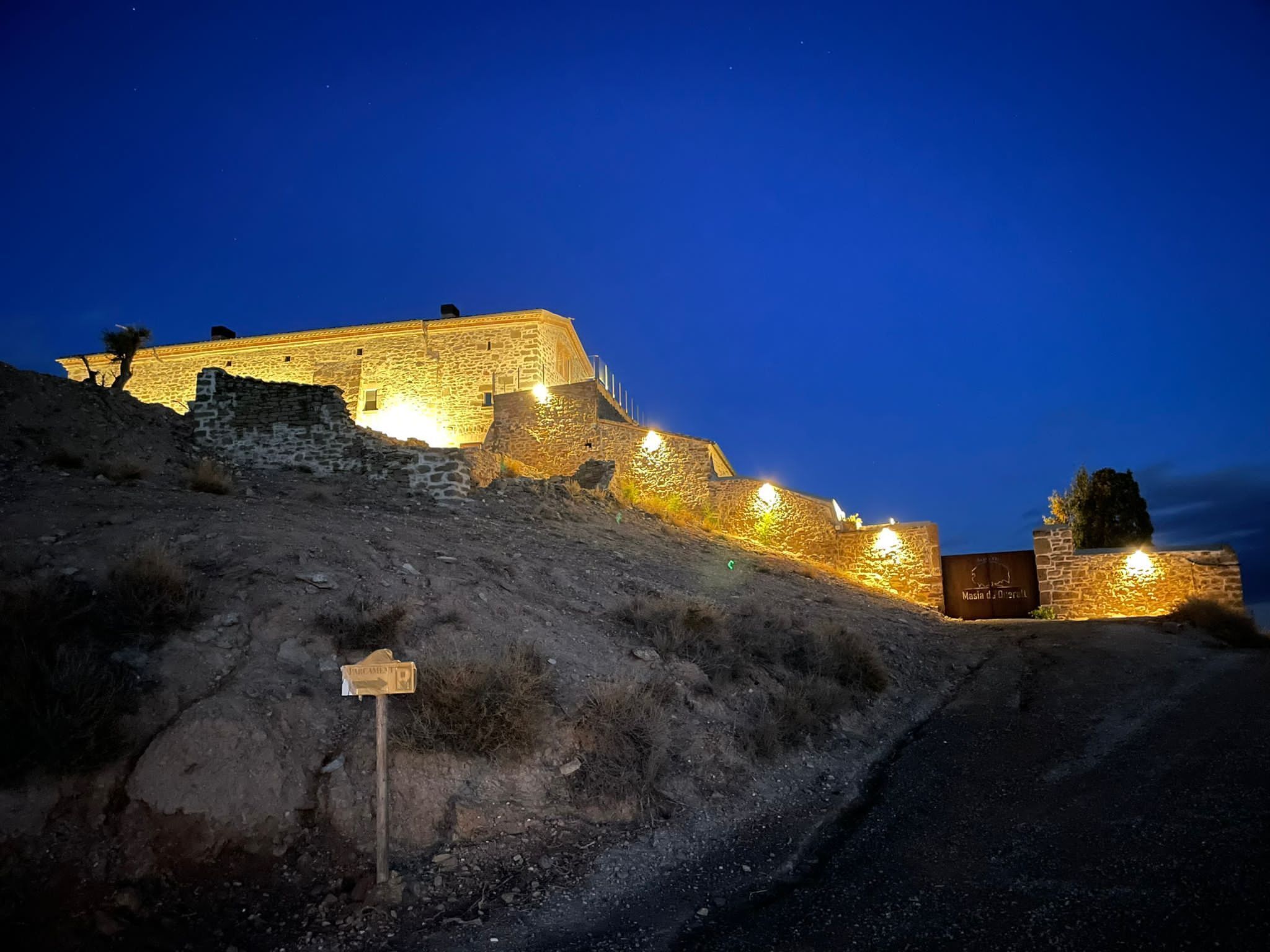 A stone fortification with a sign indicating its historical significance.