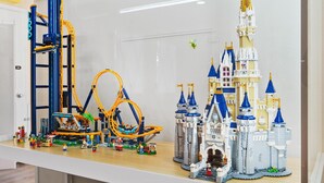 A detailed model of a theme park with a roller coaster and a castle. - LEGO Dream! 🧱🌊🕹️⛳🎥 Heated Pool, Theater, Arcade, & more! (Garden Grove)