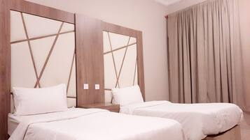 Suite Deluxe, 2 habitaciones | Ropa de cama hipoalergénica, cortinas opacas, wifi gratis y ropa de cama