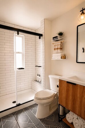 Shower, hair dryer, towels, soap
