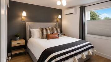 2 bedrooms, desk, blackout curtains, iron/ironing board