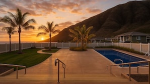 A swimming pool with a view of a sunset and mountains. - 🌺 Oahu Ocean & Mountain Views • Sleeps 14 • Pool, Spa, Near Beach, AC & BBQ 🌺 (Waianae)