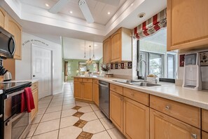 Fridge, microwave, oven, stovetop - Beauty, Tranquility & Harmony. Water Views, Heated Pool - Villa Paradise - Roelens Vacations (Cape Coral)