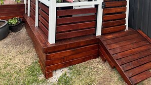 A wooden outdoor structure with a covered porch and a fenced area. - Newly Listed and Centrally located , walk to restaurant's , cafes and shopping , (Boondall)