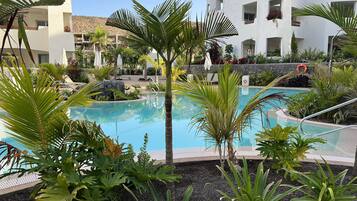 A heated pool, sun loungers