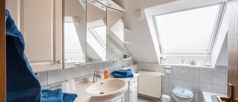 Bathtub, hair dryer, towels