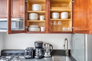 Fridge, microwave, oven, stovetop - Beautiful West Village 1BR w/ Skylight & W/D, Prime Locale, by Blueground (Downtown)