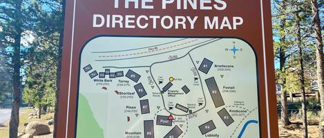 A directory map titled "THE PINES DIRECTORY MAP" with labeled areas such as White Bark, Torrey, Shortleaf, Pinon, Mountain, Golf #5 Hole, Bristlecone, Foxtail, Knobcone, Lobolly, and Longleaf.