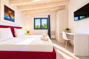 A modern hotel room with a large bed, a desk, and a TV. - Wellness & Spa, Villa STELLA - heated pool, close to beaches, playground, Istria (PULA)