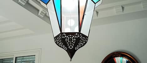 A hexagonal lantern with a geometric pattern and a central light source.