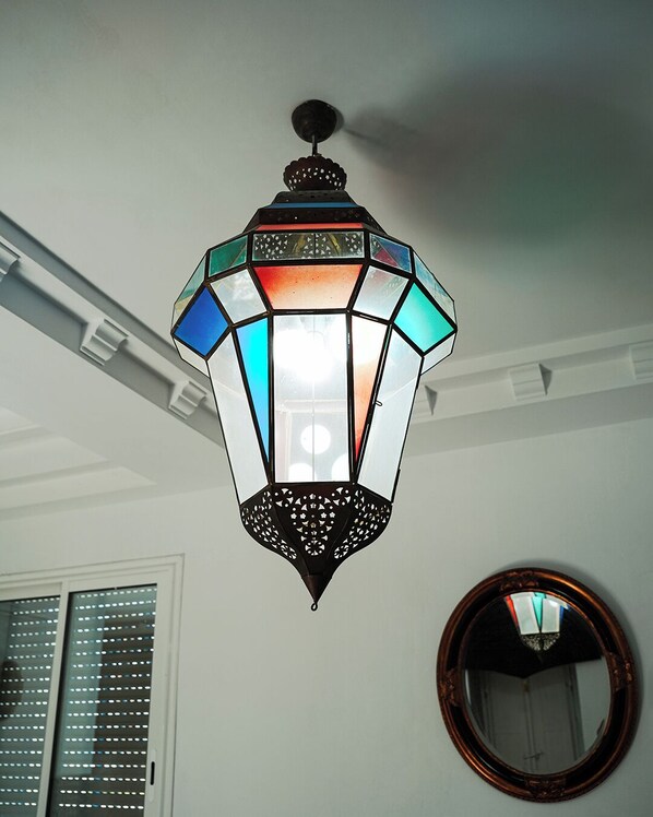A hexagonal lantern with a geometric pattern and a central light source. - BIT LELLA: Ocean View (Mahdia)