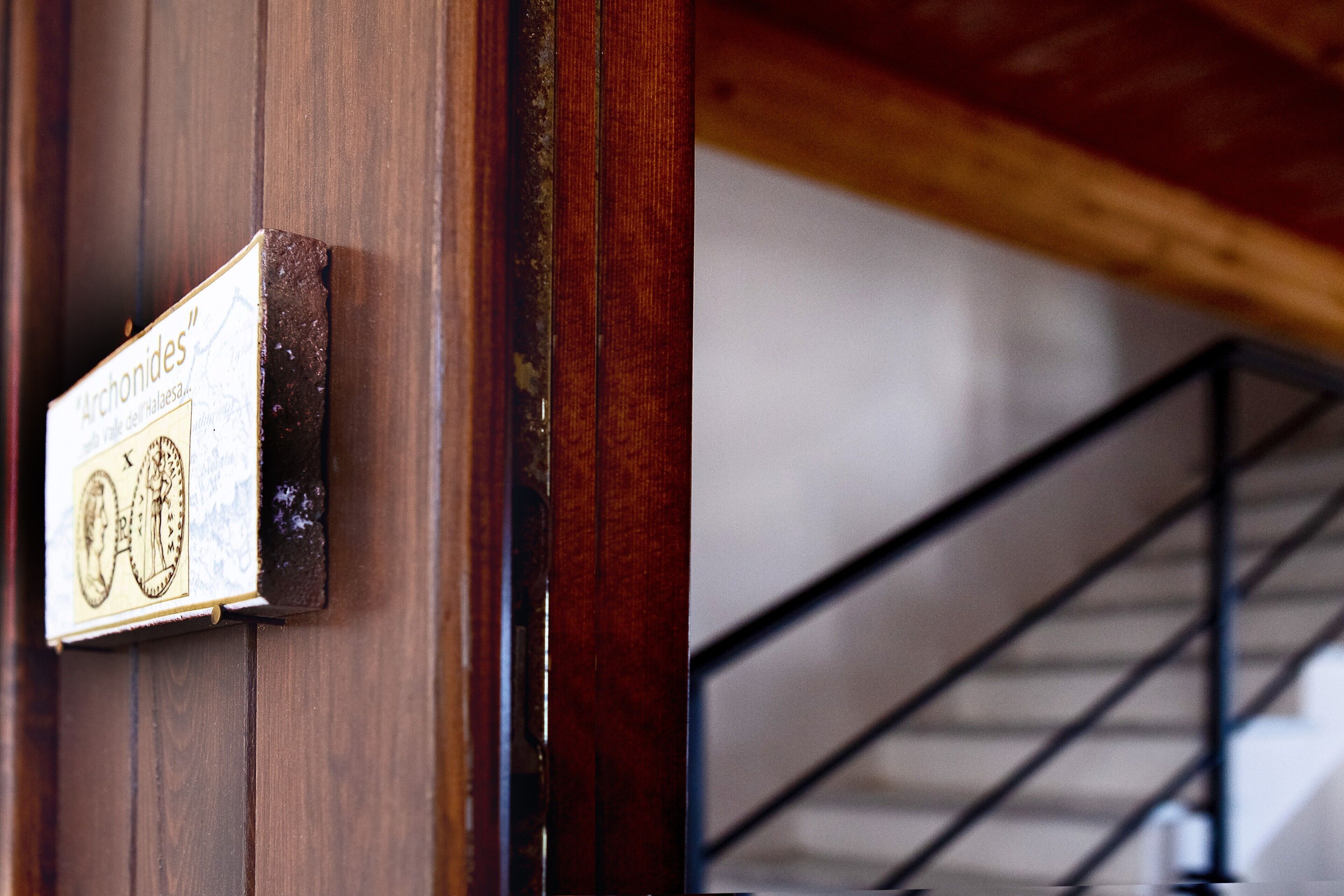 A wooden door with a sign that reads 'Archonides.'