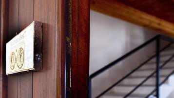 A wooden door with a sign that reads 'Archonides.'