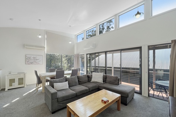 Welcome to our inviting living room! Relax in a bright, spacious setting with ample natural light.