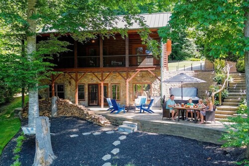 Waterfront Log Cabin w/Hot Tub, Kayaks, Firepit, King Beds, & Pets OK