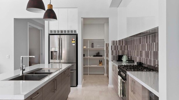 A modern kitchen with a stainless steel refrigerator, a double sink, and a gas stove. - The Witton Yarrawonga - Spring Offer (Yarrawonga)