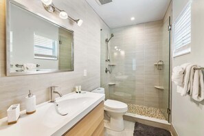 Shower, hair dryer, towels, soap