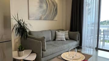 Nest Semi-Basement Apartment | Living area | 35-inch TV with digital channels