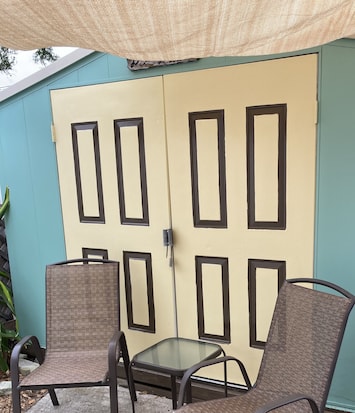 Private patio separated by a gate which enters into the large backyard.