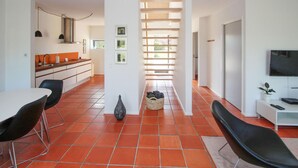 A modern interior with a kitchen, dining area, and living space. - 2 bedroom beautiful apartment in Samsø (Samsø)