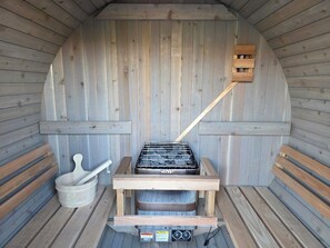 A sauna with a wooden interior, a bench, a bucket, and a wooden spoon. - Sedona Epic Dream! 5BR Pool/Slide/Spa/Sauna! (Sedona)