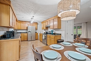 Enjoy meals in this well-lit kitchen with a central island and seating.