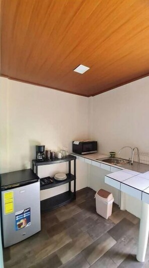Microwave, coffee/tea maker, cookware/dishes/utensils, paper towels