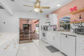 Fridge, stovetop, dishwasher, coffee/tea maker