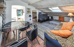 Relax in this spacious loft with a sofa, flat-screen TV, and dining area.