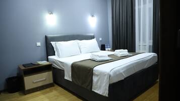 Egyptian cotton sheets, premium bedding, down duvets, minibar