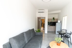 Design Apartment, 1 Bedroom | Living area | Flat-screen TV