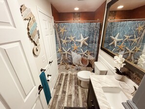Shower, hair dryer, towels, toilet paper
