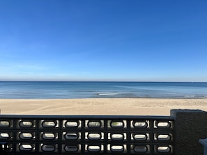 On the beach, sun-loungers
