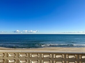 On the beach, sun-loungers