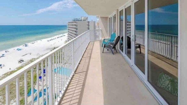 A balcony with a view of the beach and ocean. - Oceanfront Paradise: Your Dream Beachfront Escape (Panama City Beach)
